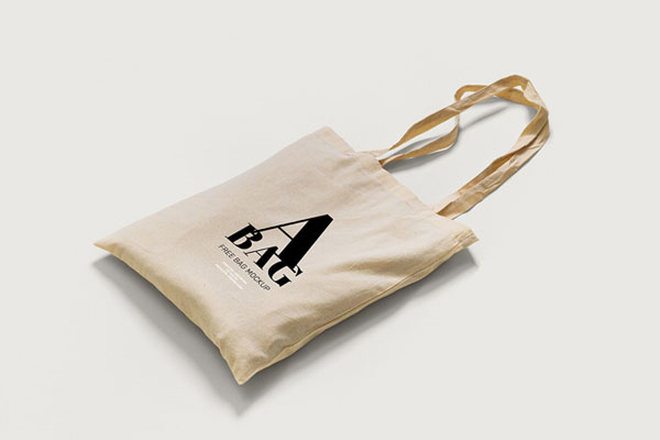 2 Mockups of Tote Bag Laid in Top and Perspective Views FREE PSD