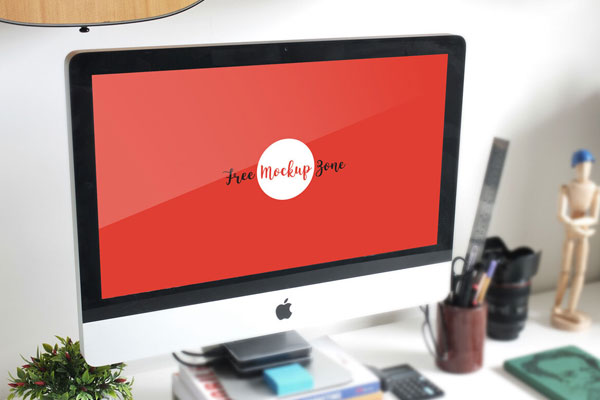 3/4 View iMac on Table Mockup with Plant and Mannequin FREE PSD