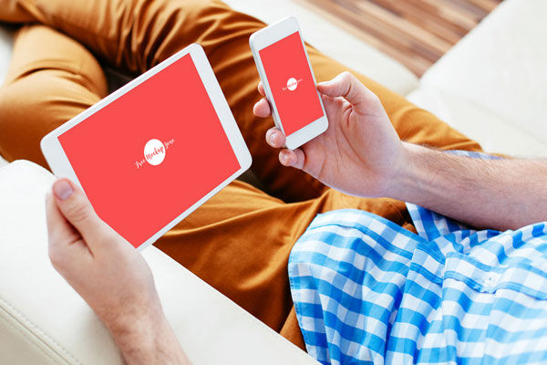 3/4 View Man Holding a Smart Phone and a Tablet Mockup FREE PSD