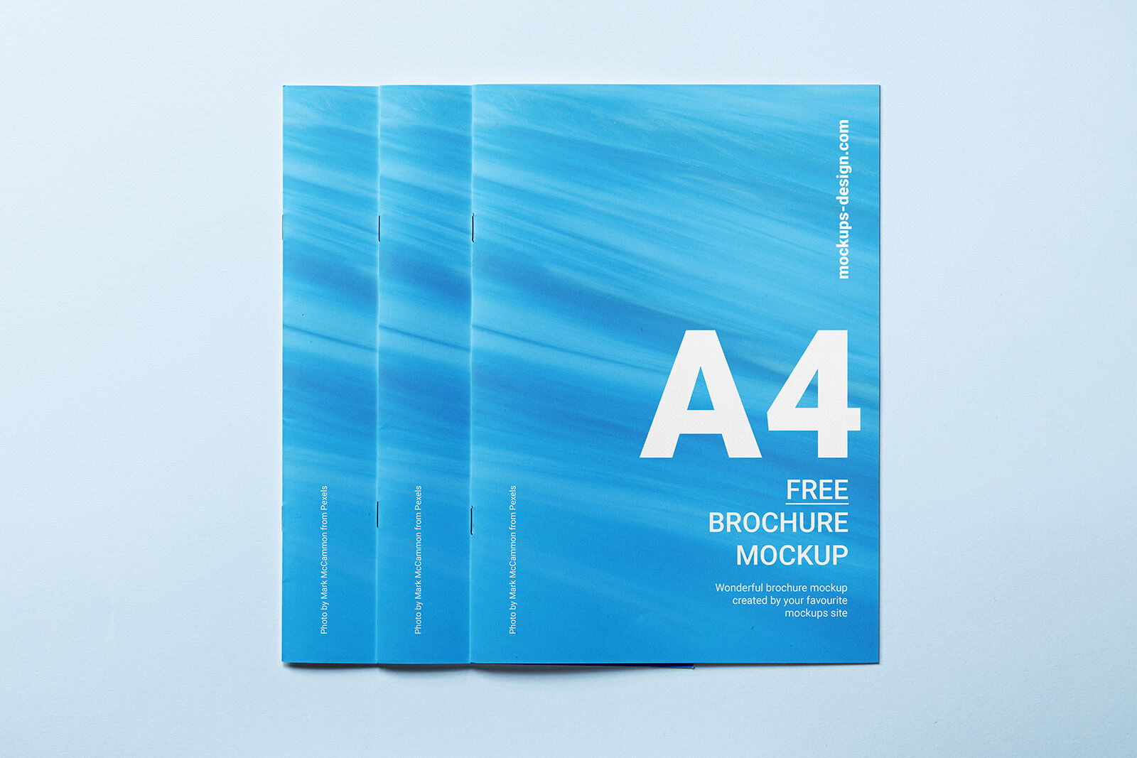 3 Mockups Including 3 Closed A4 Brochures in Different Positions