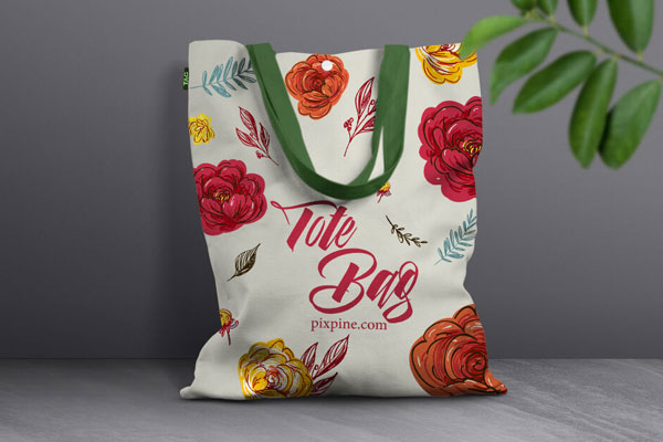 Front View Canvas Bag Leaning Against Wall Mockup with Leaves FREE PSD