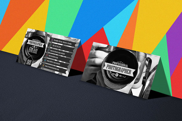 Perspective View Business Cards Leaning to a Colorful Wall Mockup FREE PSD