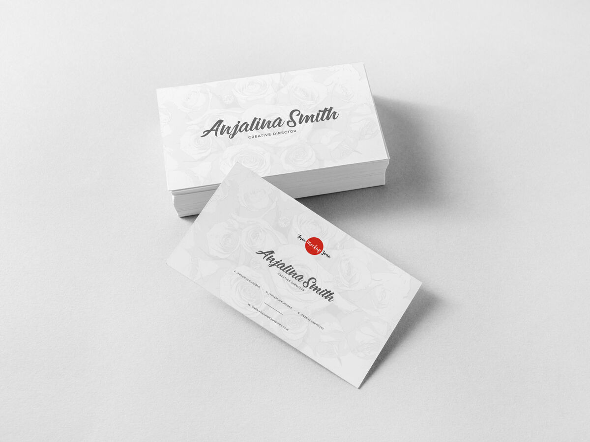 Set of Business Cards with One Leaning Against Them Mockup FREE PSD
