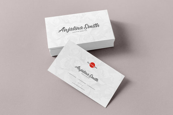 Set of Business Cards with One Leaning Against Them Mockup FREE PSD