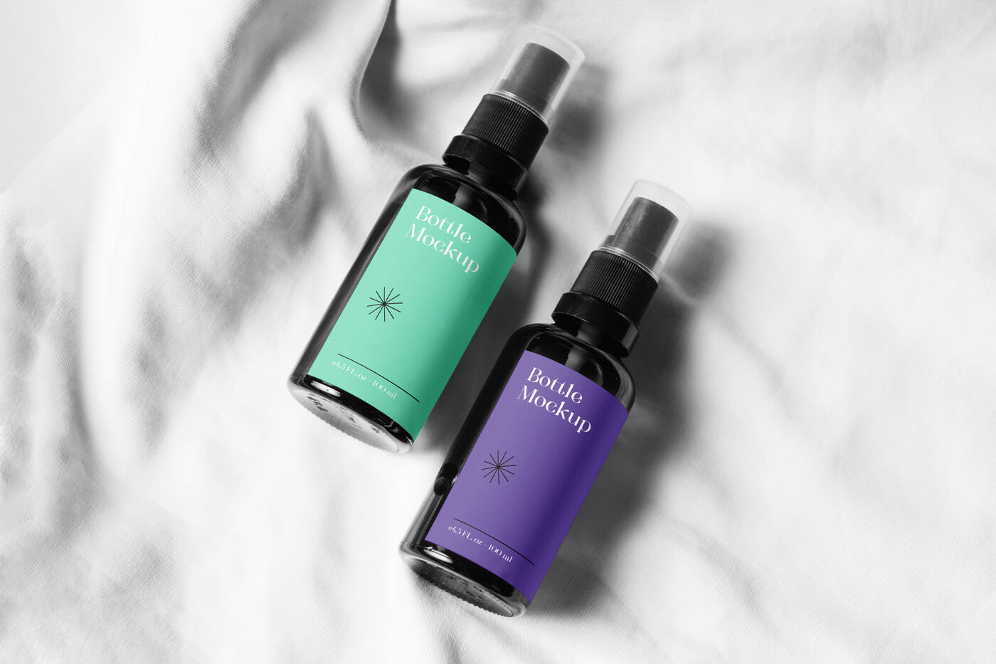 Two Small Spray Bottle on a Soft Sheet Mockup FREE PSD