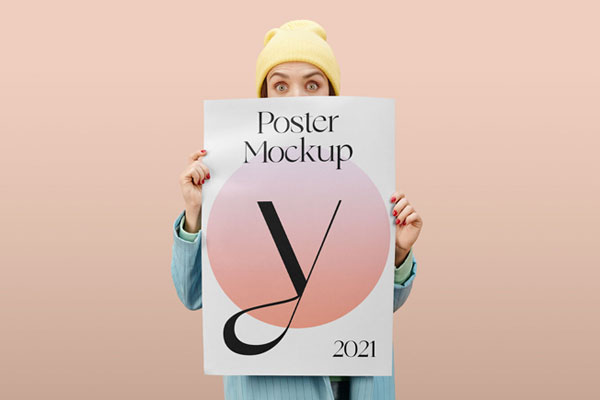 Women Holding a Poster in Front of Her Mockup FREE PSD