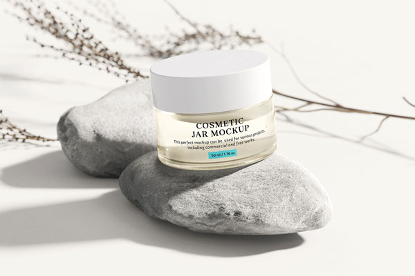 3 Cosmetic Jar Mockups Located on Stones FREE PSD