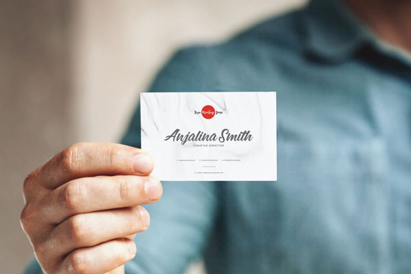 Front View of a Business Card in a Man's Hand Mockup FREE PSD