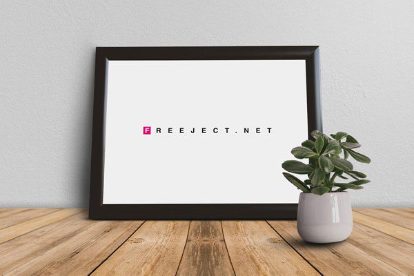 Front View Picture Frame on Wooden Table with Small Plant Mockup FREE PSD