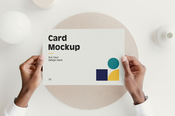 Top View of Hands Holding a Card Mockup FREE PSD