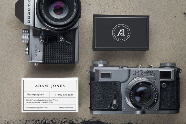 Two Business Card Mockups Next to Vintage Cameras FREE PSD