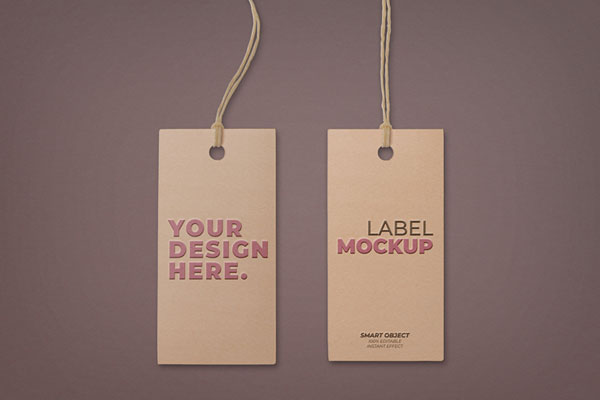 Two Embossed Hangtags Laid on the Surface in Top View Mockup FREE PSD