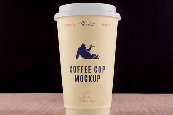 Coffee Cup Placed on Table in Front View Mockup FREE PSD