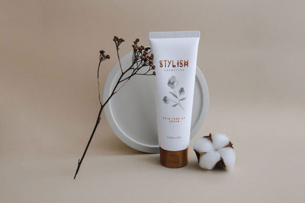 Standing Cream Tube Mockup with Decorative Elements FREE PSD