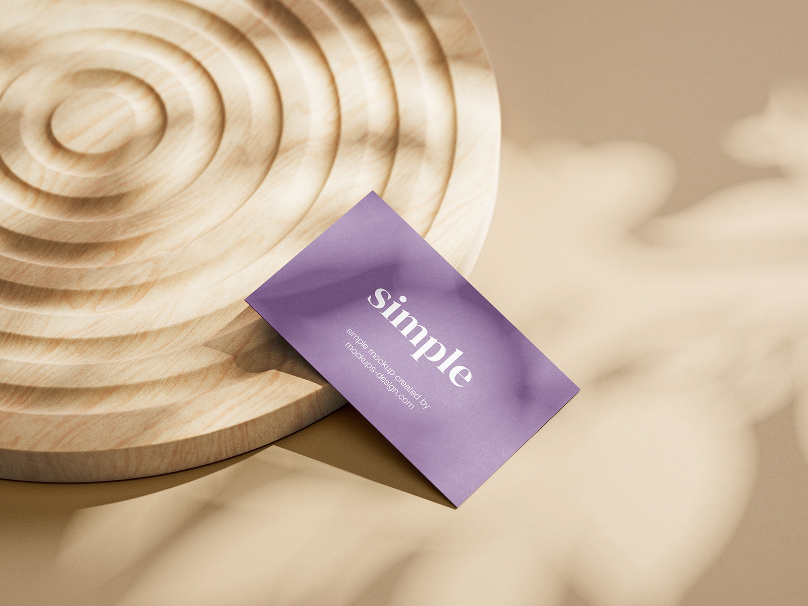 Close-up View of Three Business Card Mockups on a Wooden Ornament FREE PSD