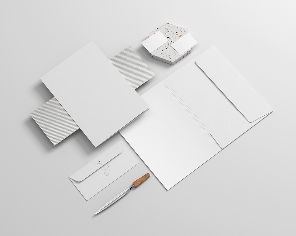 Realistic Stationery Mockup Featuring File, Envelope, Letterhead, and Business Card FREE PSD