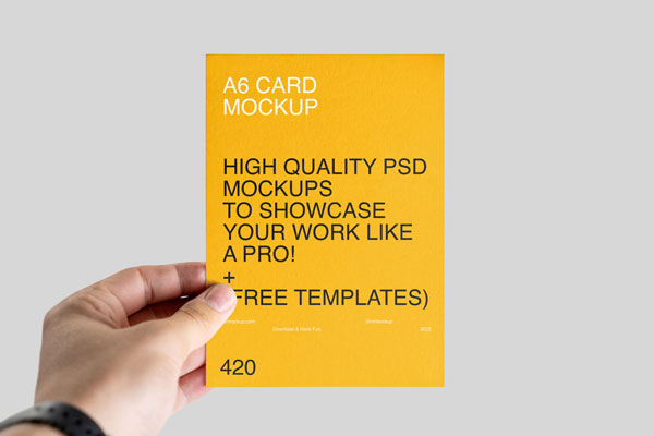 Front View of a Hand Holding an A6 Leaflet Mockup FREE PSD