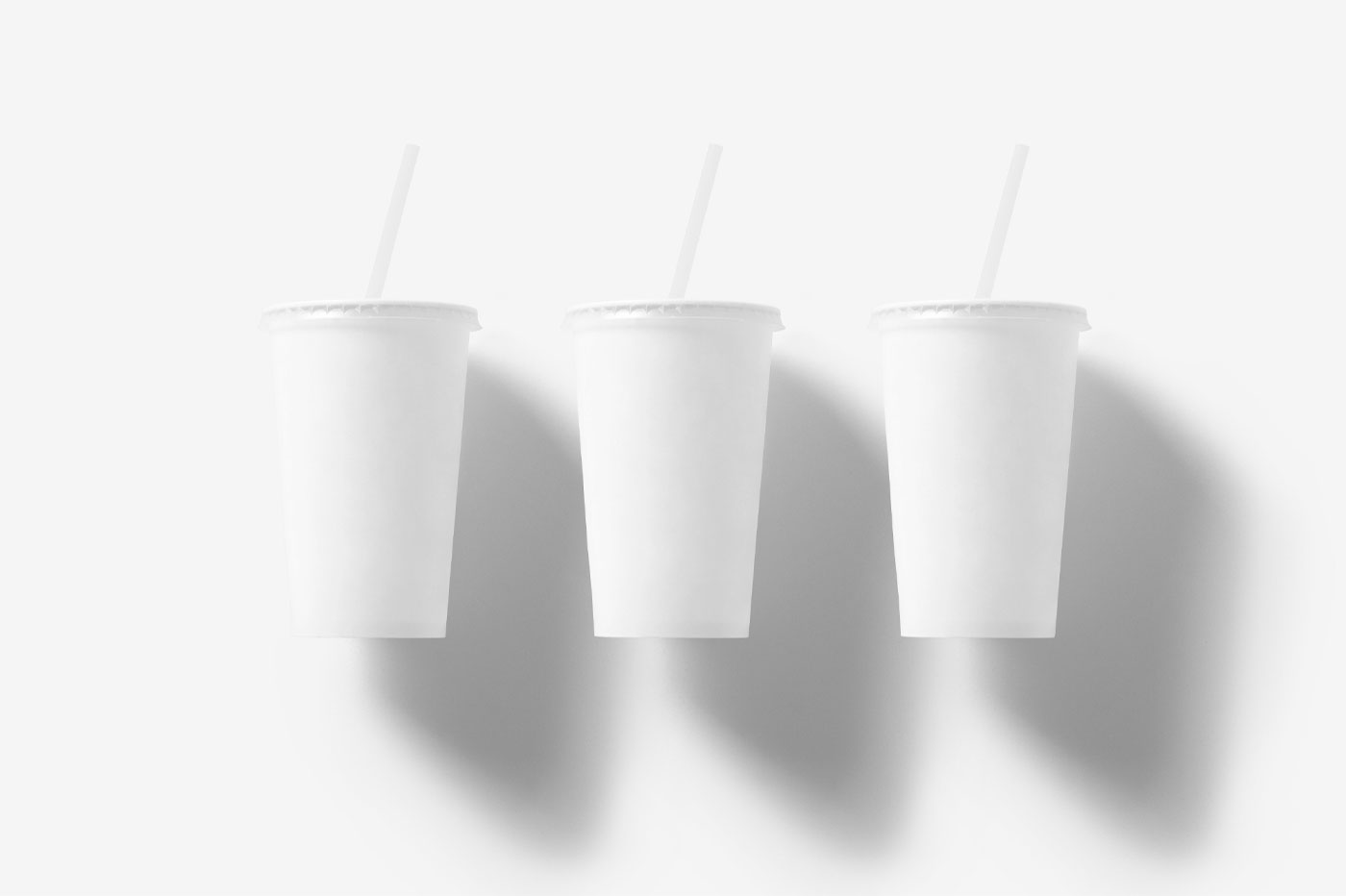 Mockup of 3 Floating Coffee Cups with Straws in the Front View FREE PSD