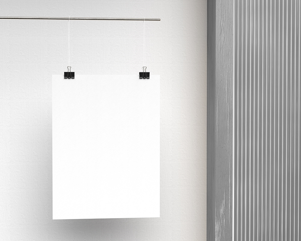 Mockup Showcasing a Vertical Poster Hanging with Paper Clips FREE PSD