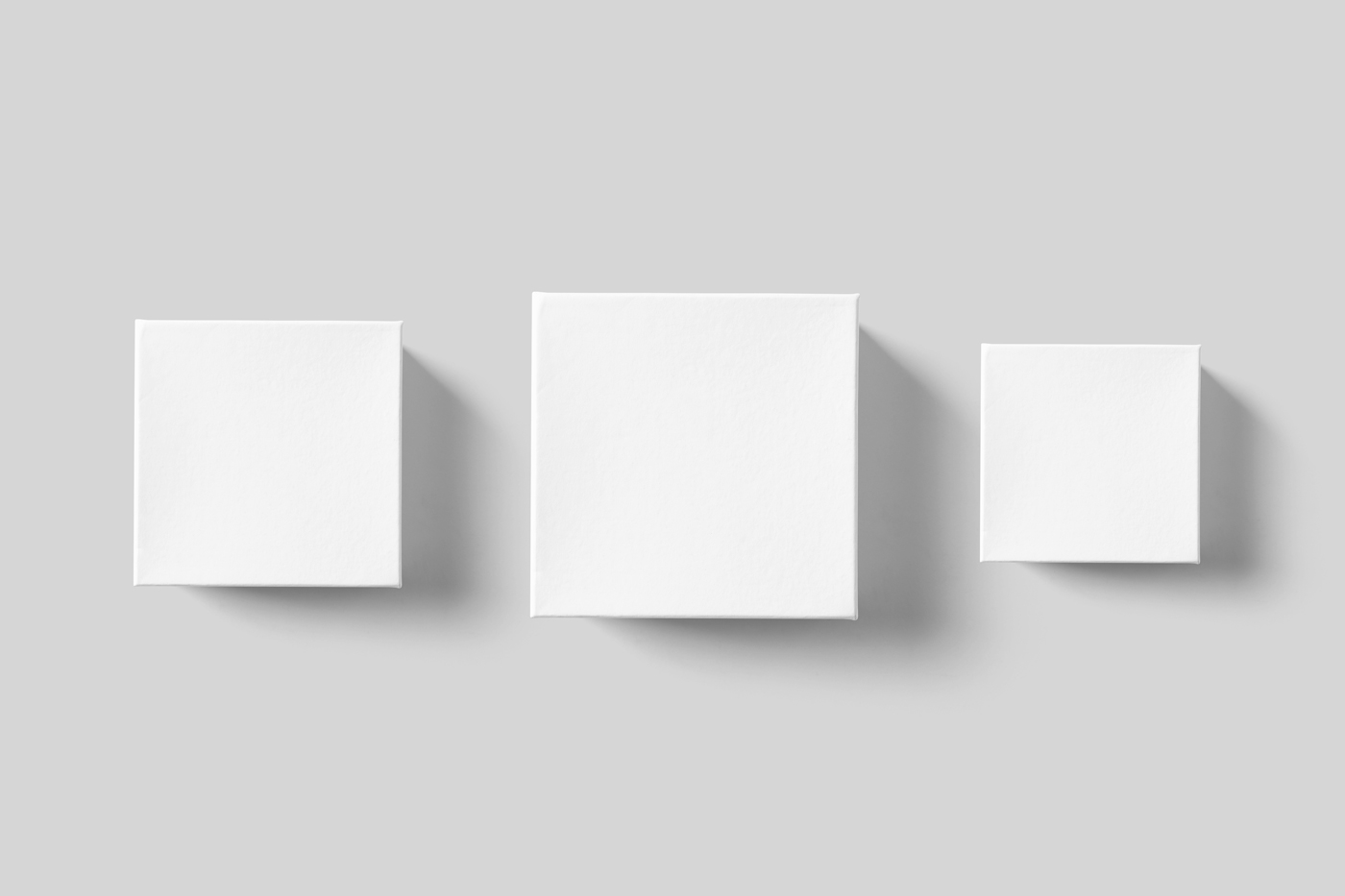 Three Square Paper Boxes Mockups in Different Sizes FREE PSD