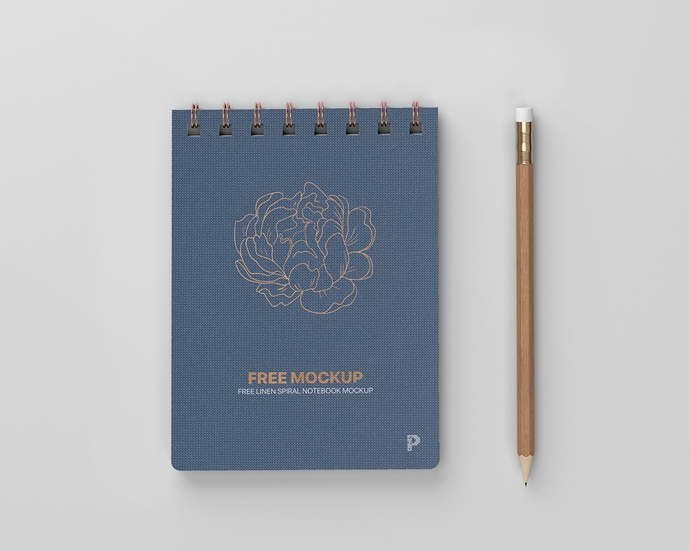 Top View of a Linen Spiral Notebook Mockup FREE PSD