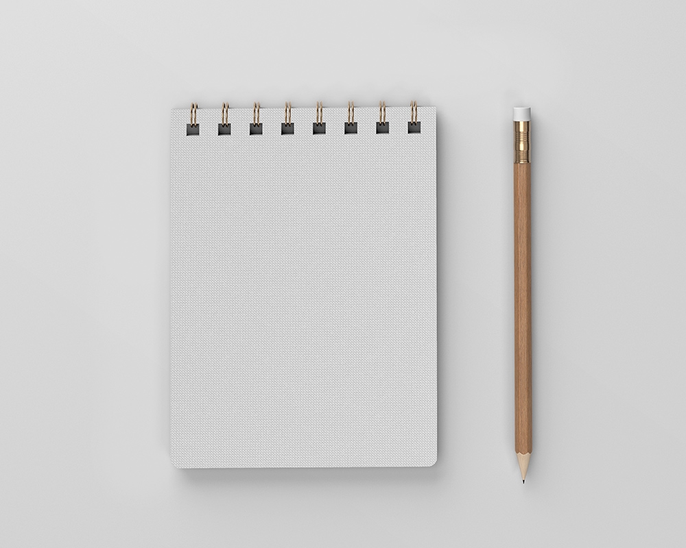 Top View of a Linen Spiral Notebook Mockup FREE PSD