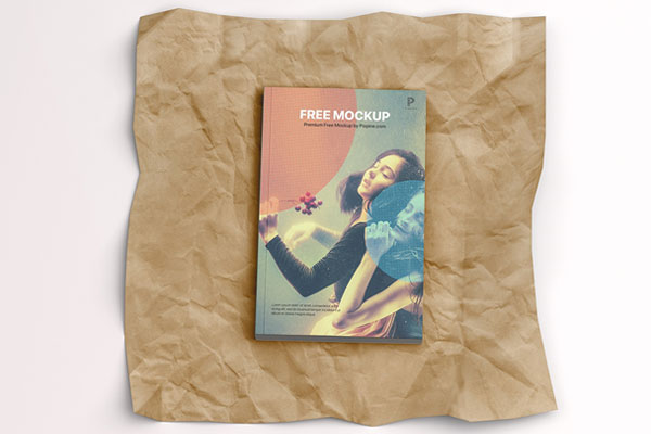 Top View of a Softcover Book on a Wrinkled Paper Mockup FREE PSD