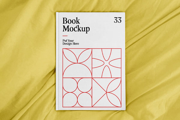 Top View of an A4 Book Hardcover on a Sheet Mockup FREE PSD