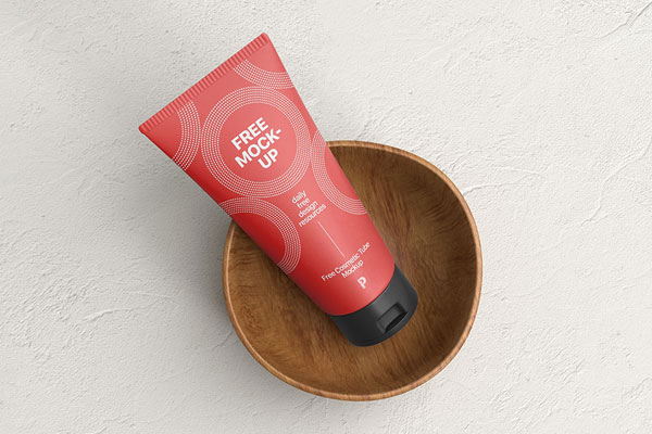 Top View of Cosmetic Tube Mockup on a Wooden Cup FREE PSD