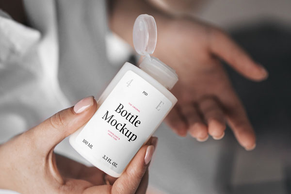 Woman Holding Realistic Mini Bottle Mockup from Top View FREE PSD
