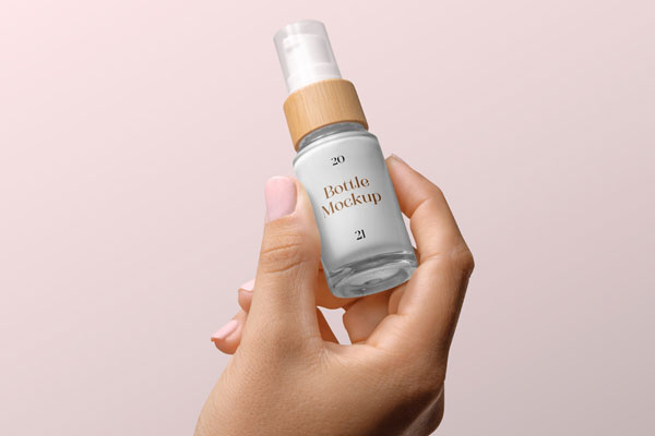 Woman Hand Holding Minimal Cosmetic Bottle Mockup FREE PSD