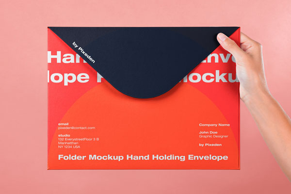 Front View of a Hand Holding Large Envelope Mockup FREE PSD