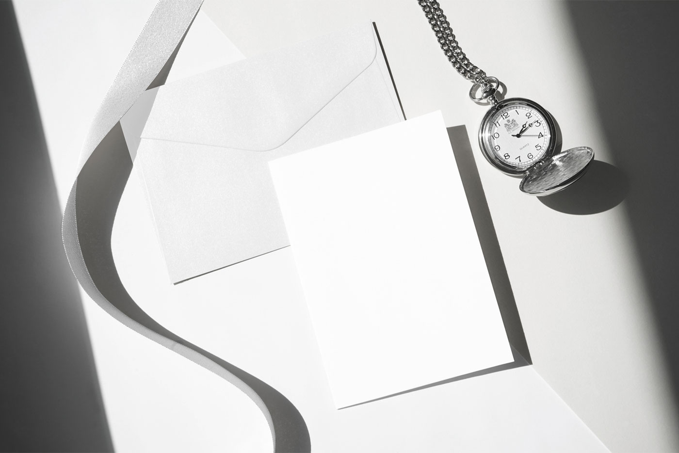 Angled Top View of an Envelope Mockup with Card and Watch FREE PSD