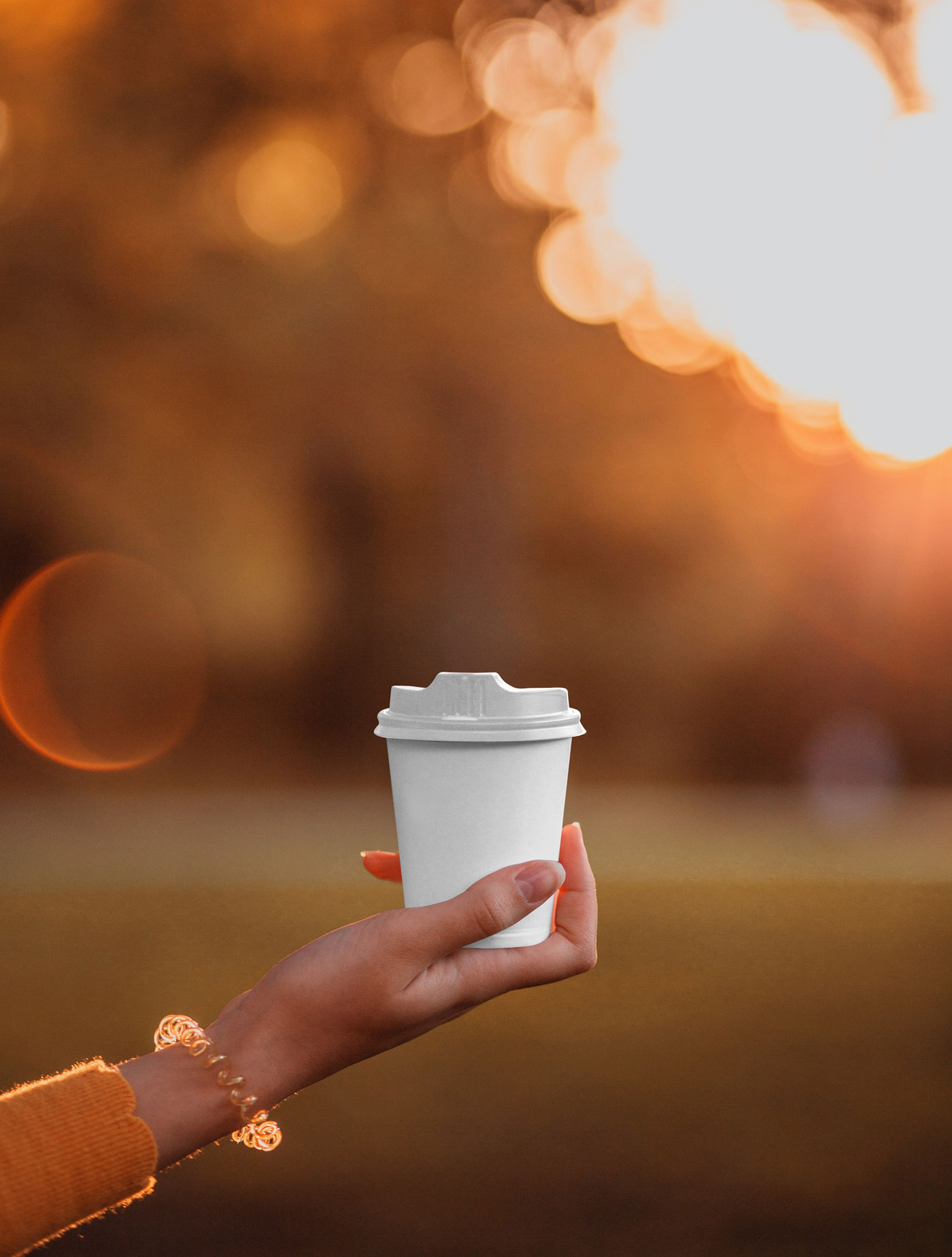 Front View of Small Woman Hand Holding Coffee Cup Mockup FREE PSD