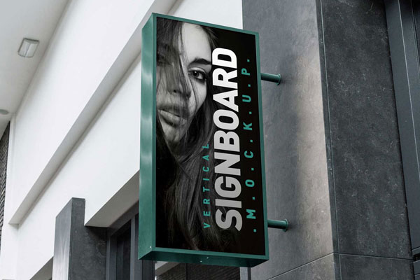 Vertical Shop Signboard Mockup with Metallic Frame on Building Free