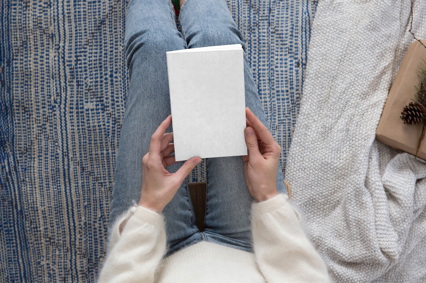 Top View of a Woman Holding Book Cover Mockup FREE PSD