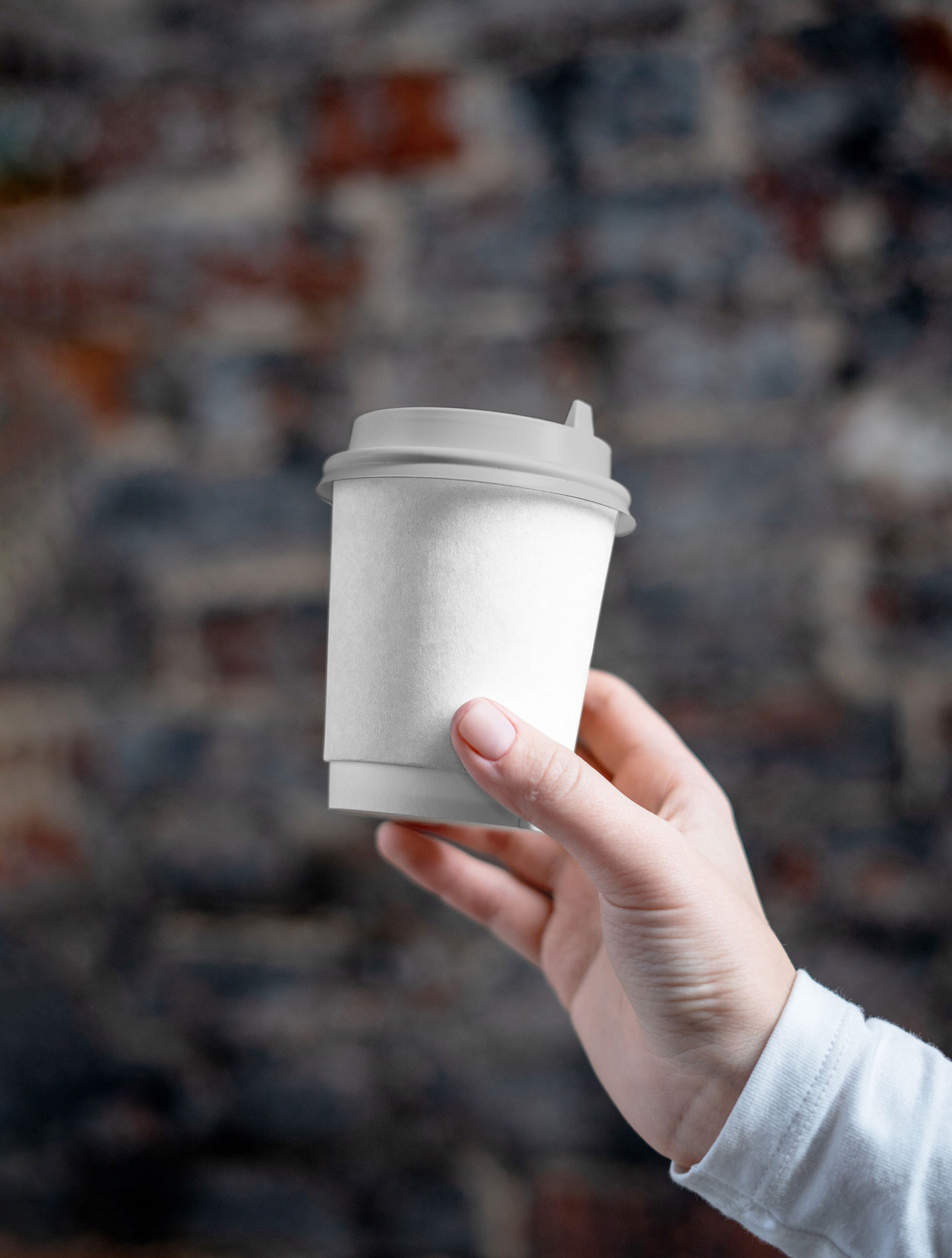 Front View of a Hand Holding a Coffee Cup Mockup FREE PSD