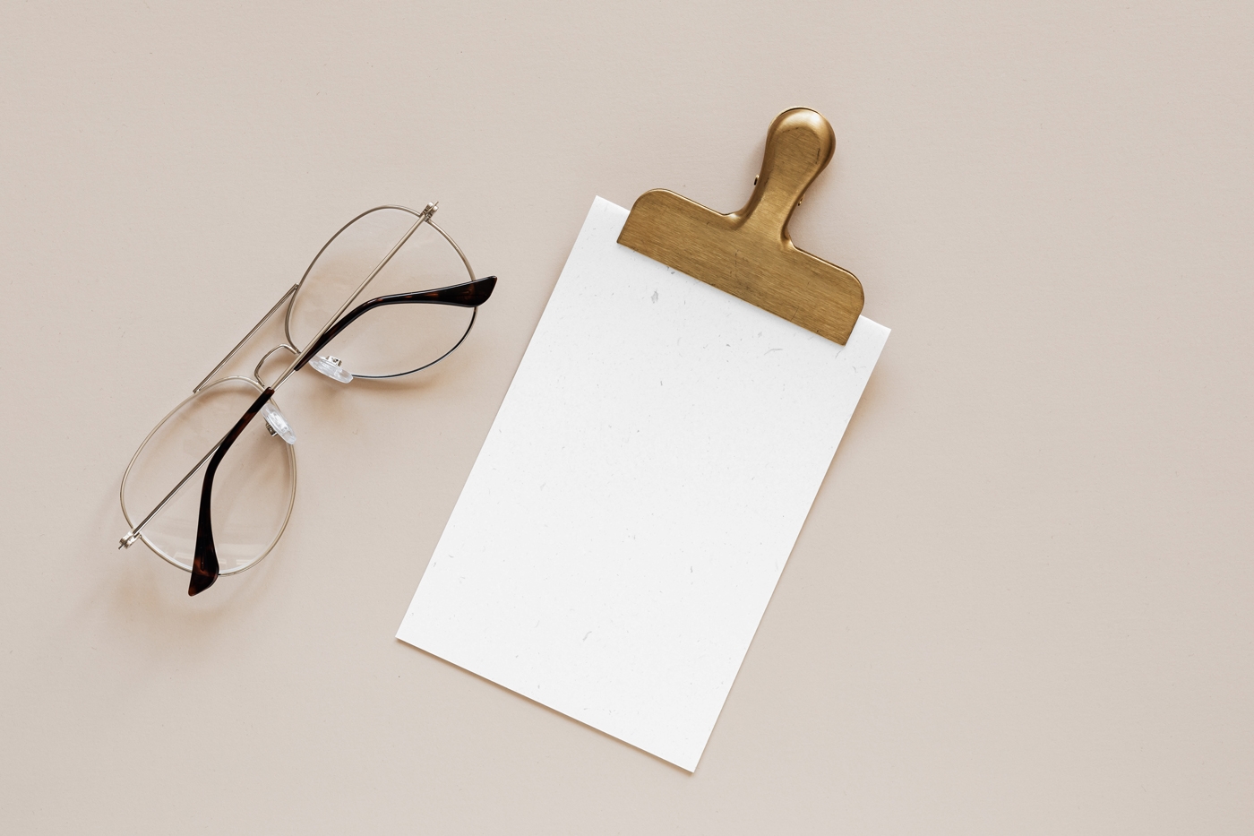Top View of Elegant Card Mockup Featuring Clip and Glasses FREE PSD