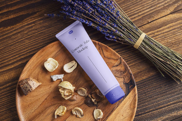 Trendy Cosmetic Tube Mockup Featuring Rustic Surface and Lavender FREE PSD