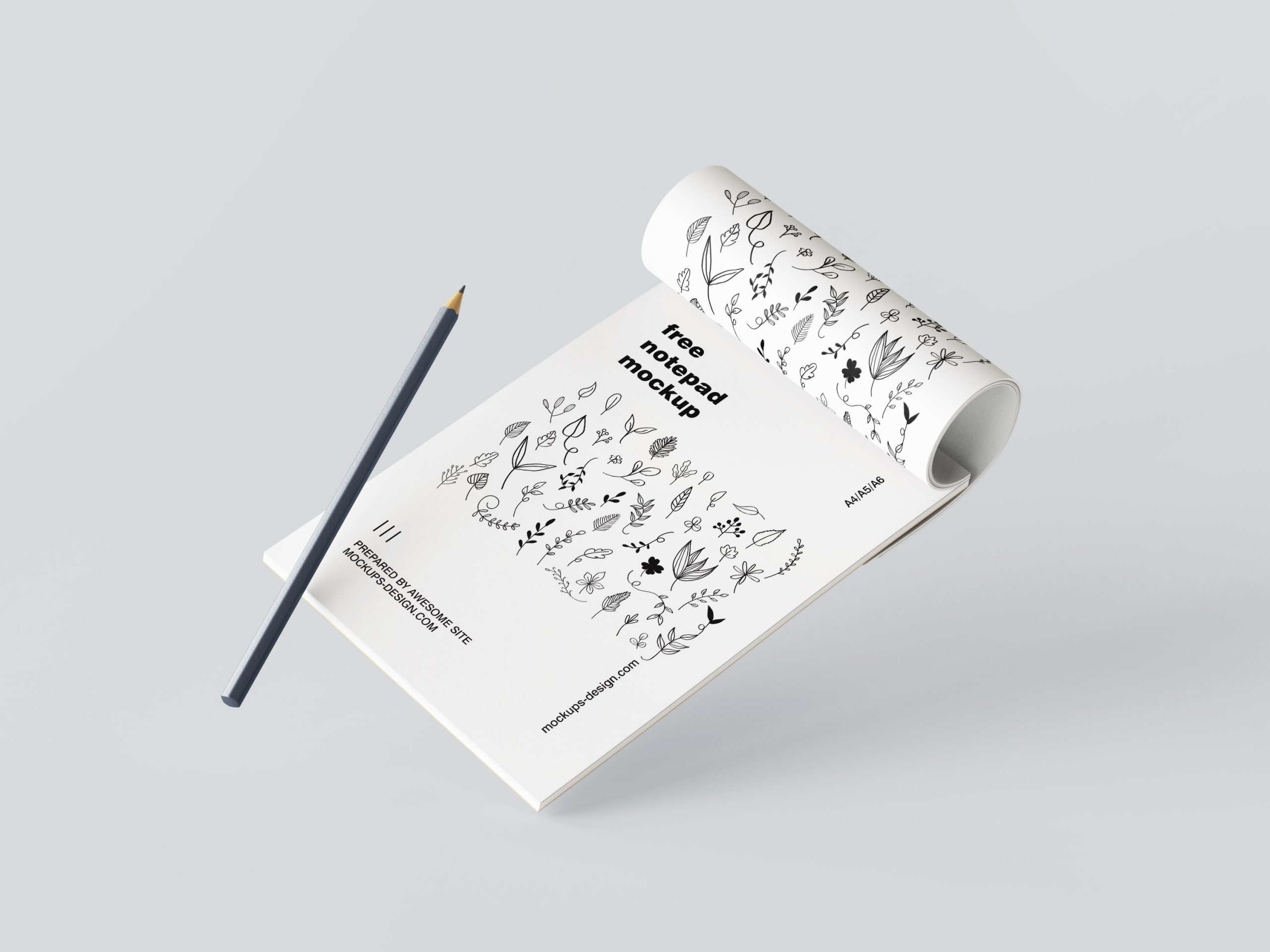 5 Mockups of Notepad with Pencil in Various Perspective Views FREE PSD