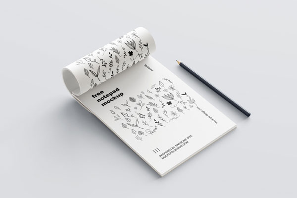 5 Mockups of Notepad with Pencil in Various Perspective Views FREE PSD