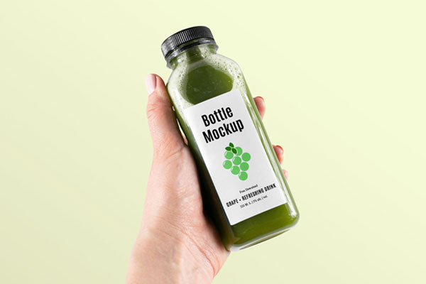 Hand-holding Healthy Bottle Mockup FREE PSD