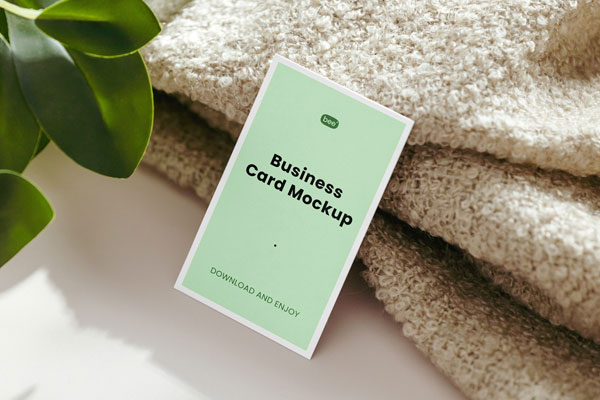Realistic Business Card Mockup Featuring Blanket and Plant FREE PSD