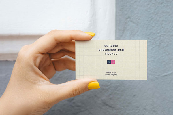 Top View of a Hand Holding a Business Card Mockup FREE PSD