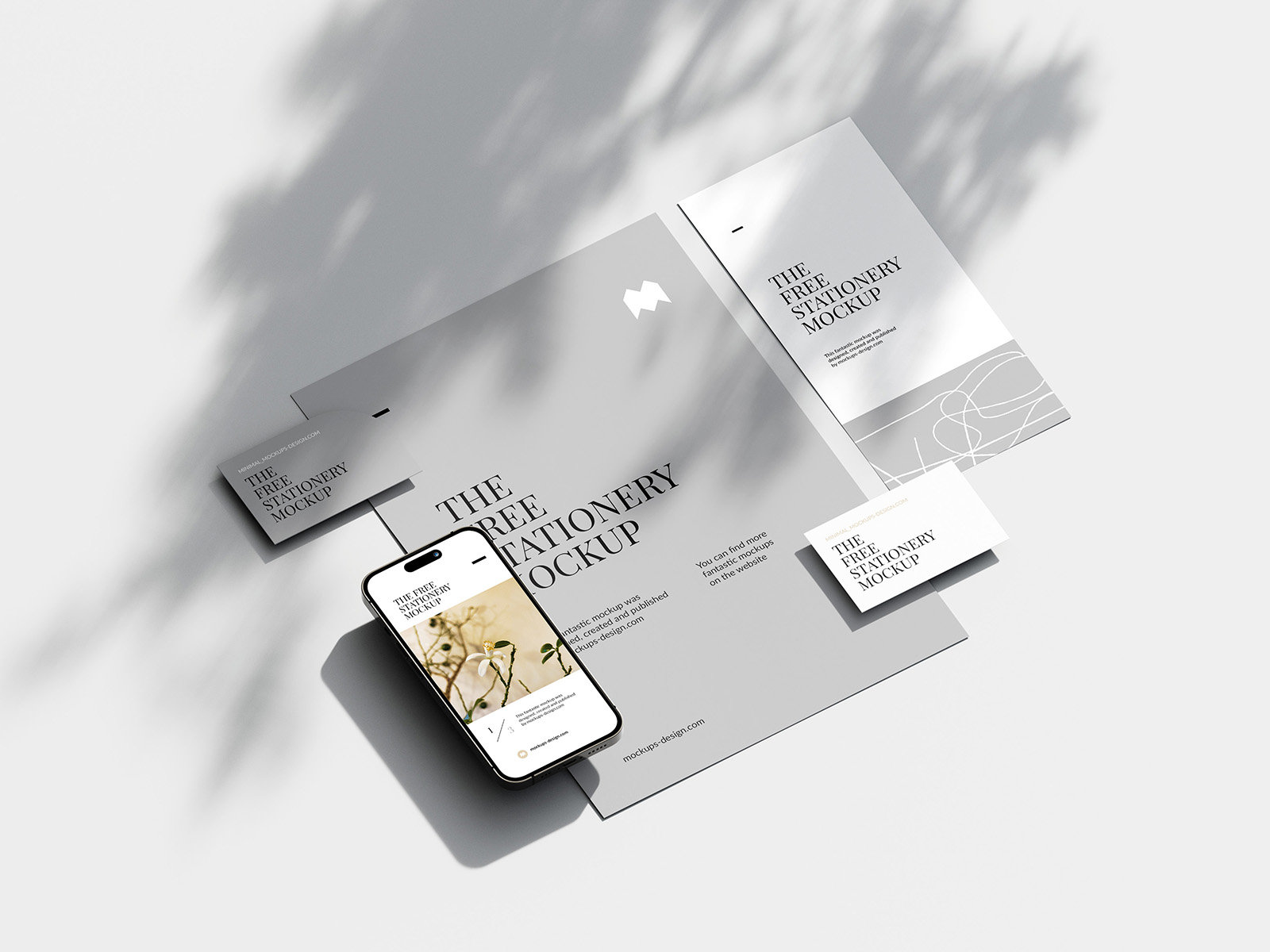5 Shots of Mobile Mockup and Stationery with Natural Shadows FREE PSD