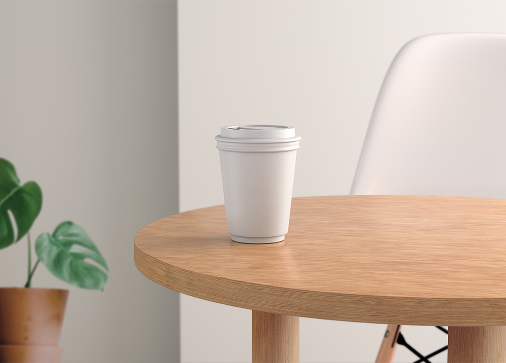 Front View of Paper Coffee Cup Mockup on Rustic Table FREE PSD