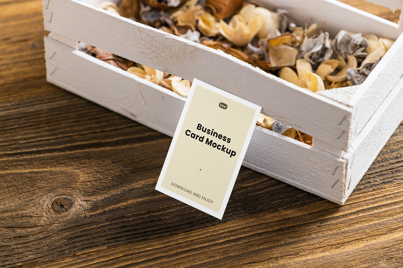 Perspective View of a Business Card Mockup Leaning on a Wooden Box FREE PSD