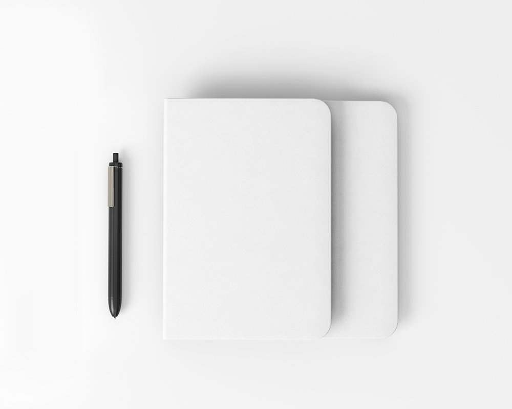 Top View of Notebook Mockup with Pen FREE PSD
