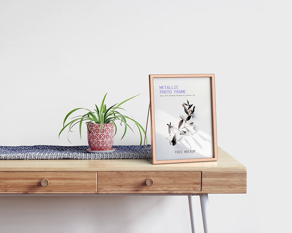 Metallic Photo Frame Mockup On Wooden Table (FREE) | Resource Boy