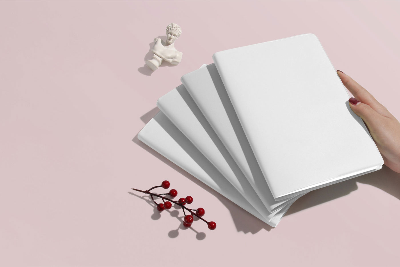 Perspective View of 4 Notebooks Mockup on Top of Each Other FREE PSD